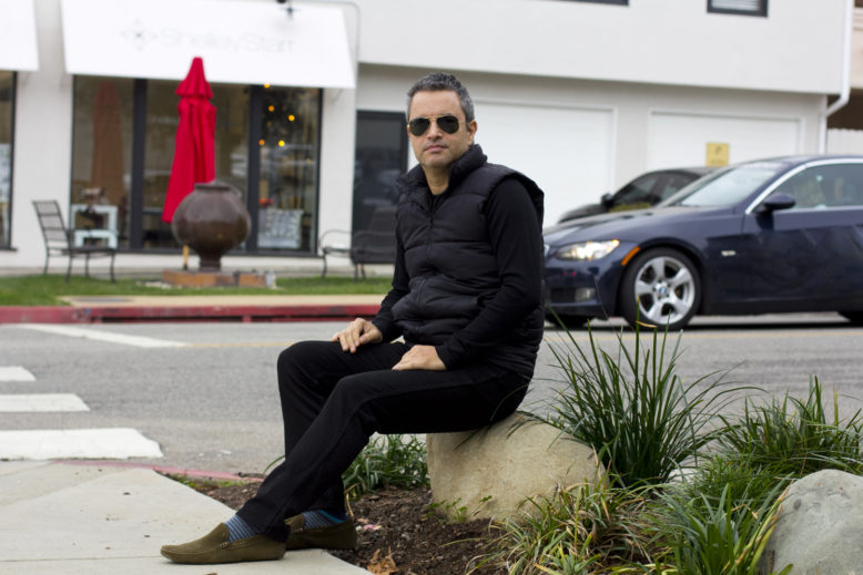 My coffee and a black vest outfit in Santa Monica